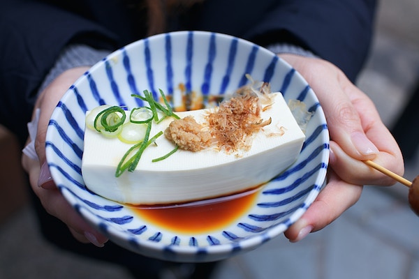 tofu in bowl with greens super food for menopause